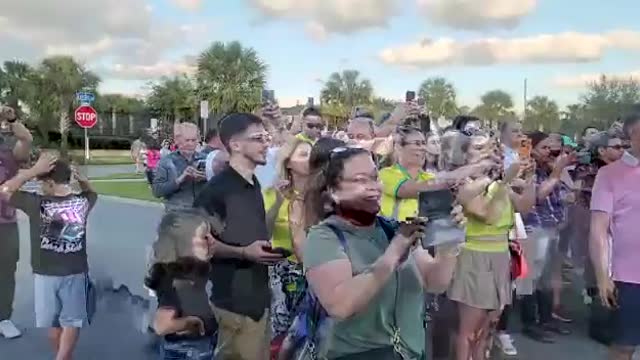 FANS OF JAIR BOLSONARO STAND LINE UP TO TAKE A PICTURE WITH THE FORMER PRESIDENT OF BRAZIL