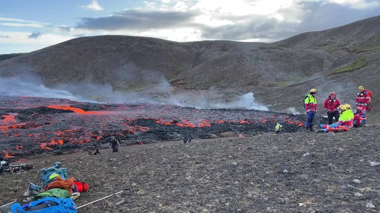 People watch as lava spews out of volcanic fissure in Iceland | AFP