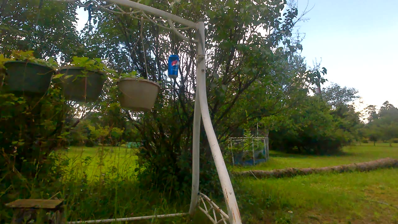 slingshot target on a can with water