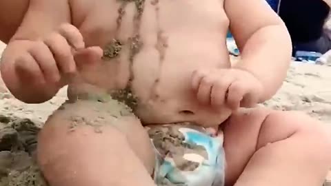 Baby reaction on the beach