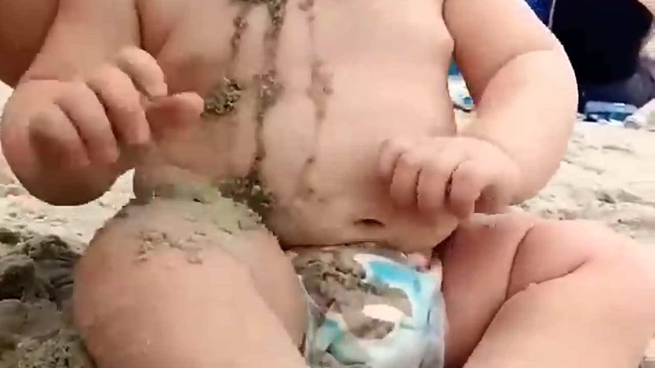 Baby reaction on the beach