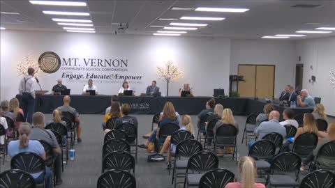 Doctor speaks at school board meeting.