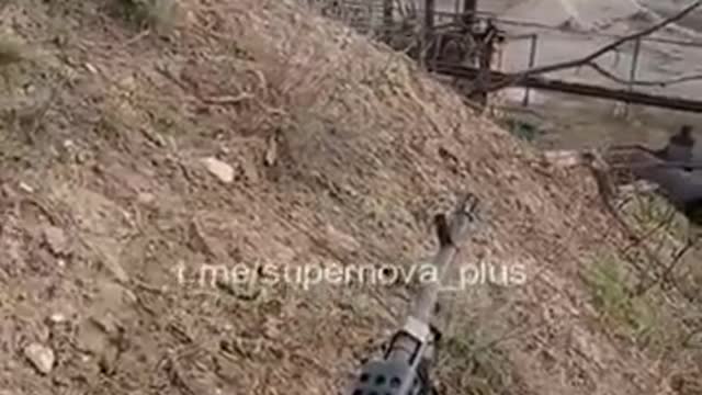 Ukrainian forces in a firefight with the support of a tank