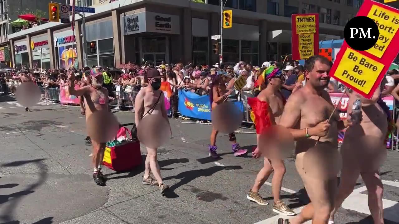 Naked people march in the Toronto Pride Parade.