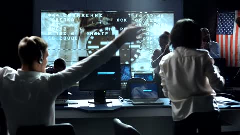 People on a space mission control celebrating