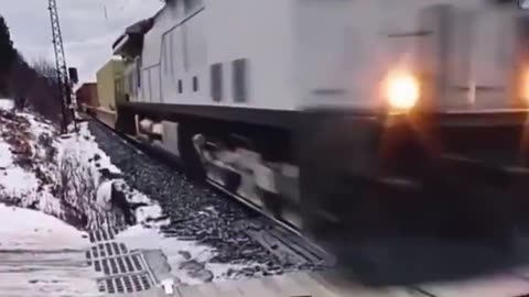 Train and Car Collision; This Car Must Be from the Future