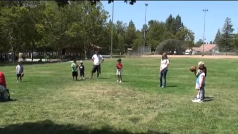 Jessica playing baseball