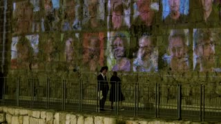 Oct. 7 hostage images light up Jerusalem on anniversary eve