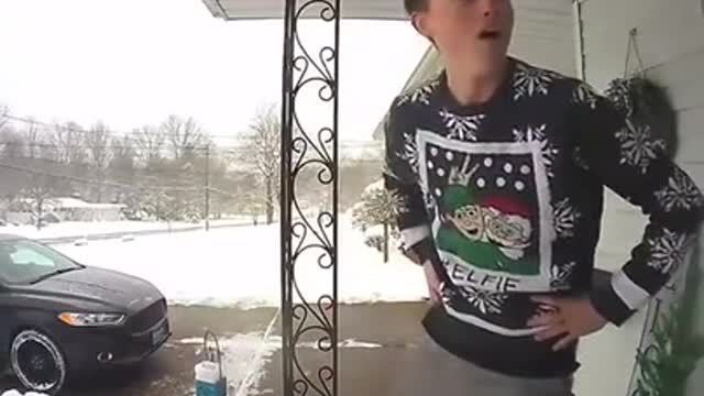 Son Drops Christmas Gift on Wet Porch While Bringing it Inside