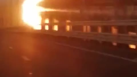 Footage of a burning fuel tank on the railway line of the Crimean bridge