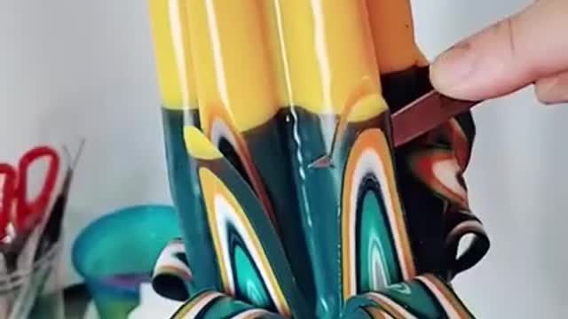 Person Creates Amazing Designs On a Candle While Carving It