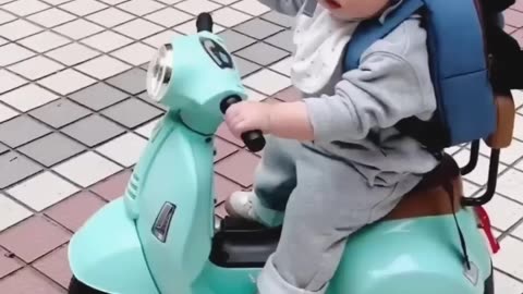 Cute kid driving bike......