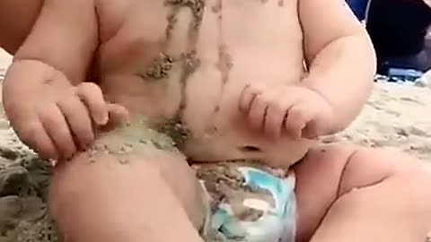 funny baby reaction on the beech