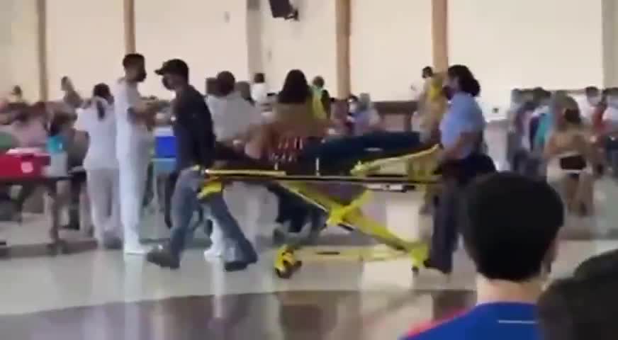 CAUGHT ON FILM: LADY WHEELED OUT OF THE COVID-19 VACCINATION CLINIC ON A STRETCHER