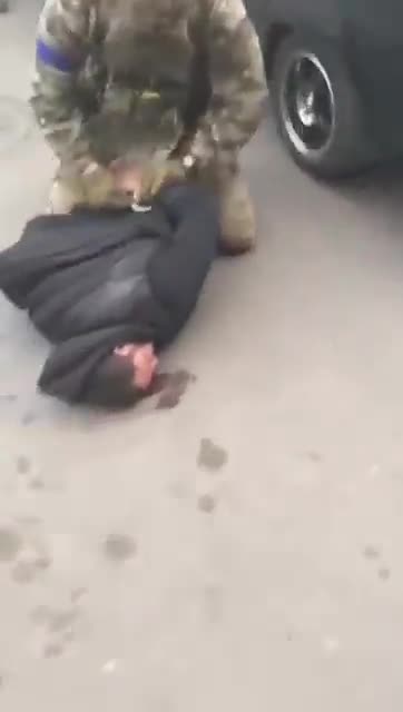 Ukranian soldiers beating ukranians civilians again
