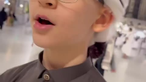 Cute Boy Reciting Beautiful Verses of Quran at the Most beautiful palce of world