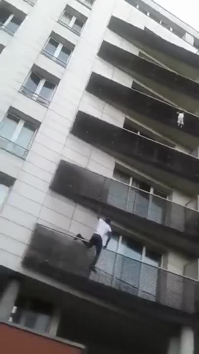 FRANCE — Young Man Scales Building In Seconds To Save Dangling Toddler!