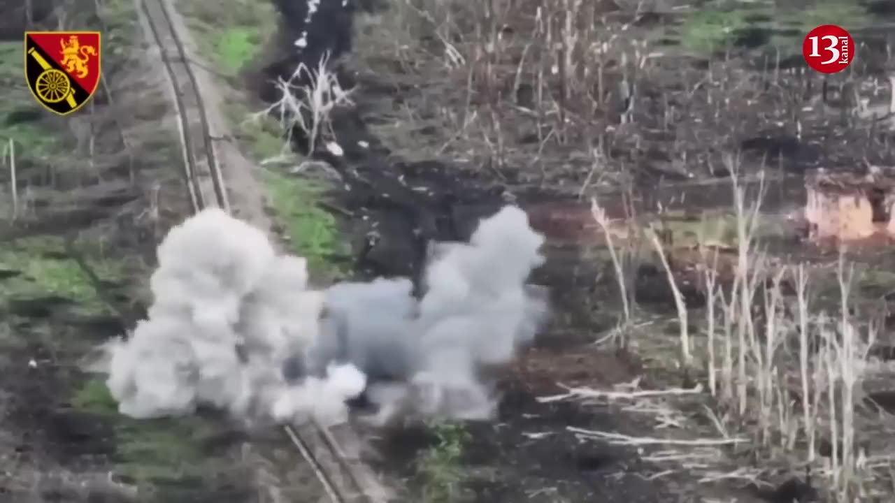 After their tanks are destroyed, Russians seek to drag their dead fellow soldiers away