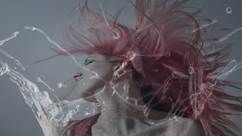 Drop of water splashing and a portrait of a woman