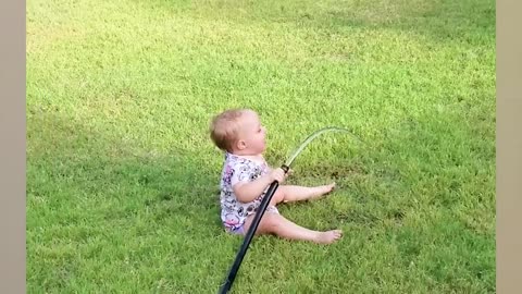 Funny Babies playing with water