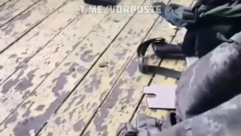 Ukraine military inside school gymnasium with weapons