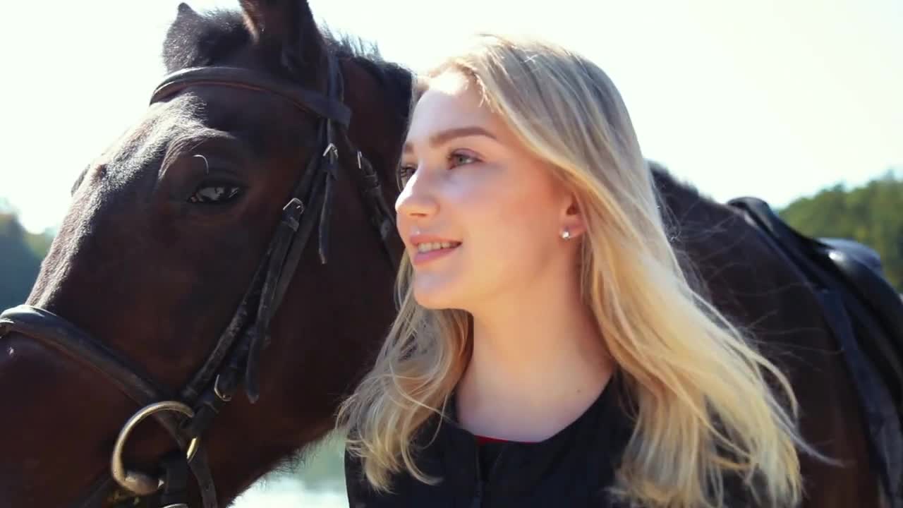 Young woman with a horse