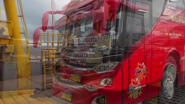 The Bus Enters the Ship from Bali Island to Java