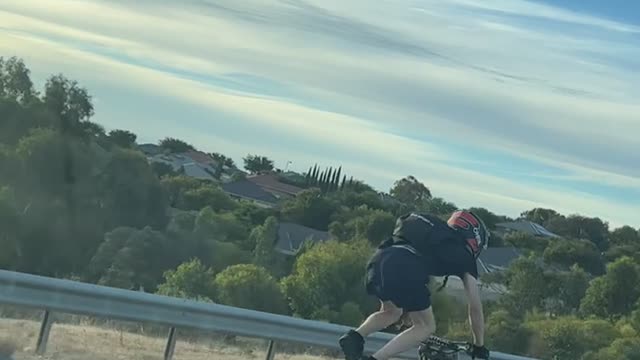Young Motorcyclist Does High Speed Stunts