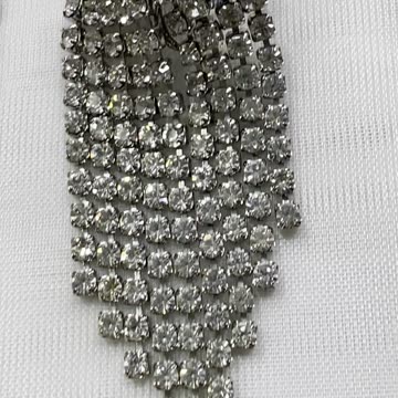 Rhodium Plated 2.75” Drop Earrings. Made with Swarovski Crystal. Clip On