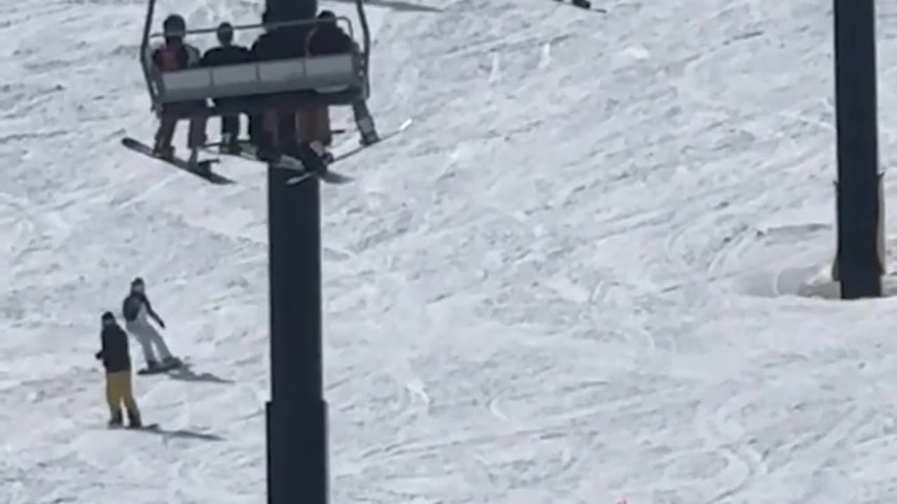 Horror moment teen snowboarder falls from chairlift