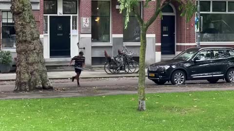 CROSSING A CANAL ON A SKIMBOARD