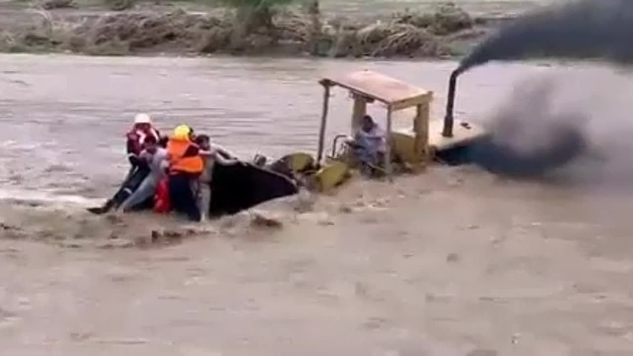 Rescue of people caught in flash flood by guy in bulldozer!!!!!