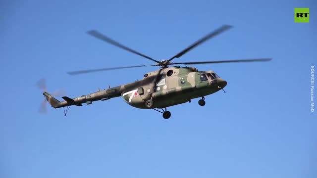 Russian helicopters provide air cover for supply train