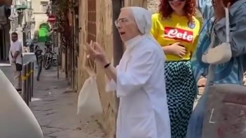 Nun pulls apart girls kissing during photo shoot in Naples