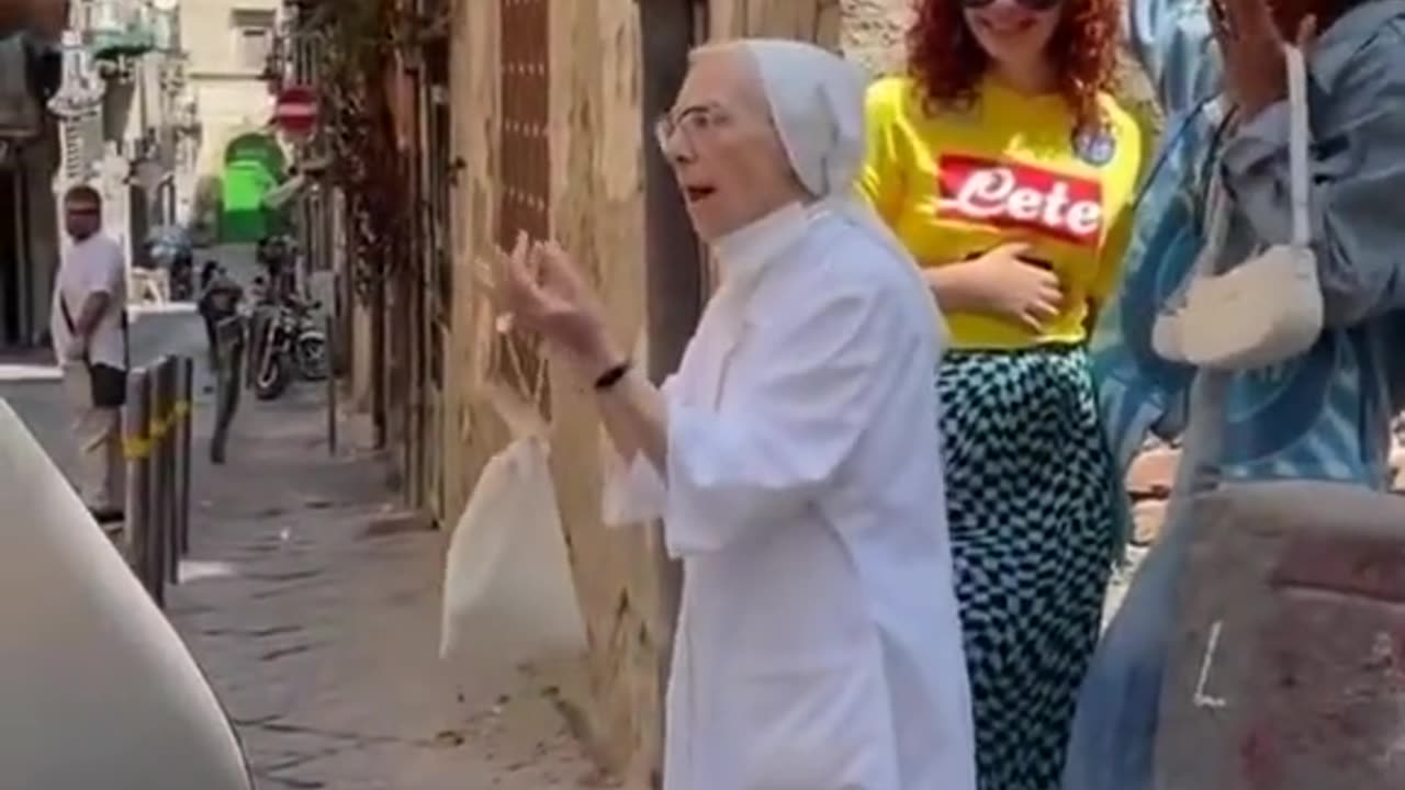 Nun pulls apart girls kissing during photo shoot in Naples