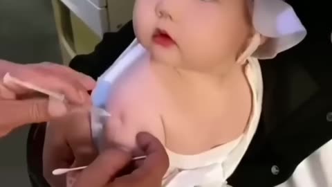 Baby reaction to a syringe