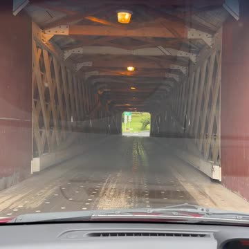 driving through a cover bridge in new england