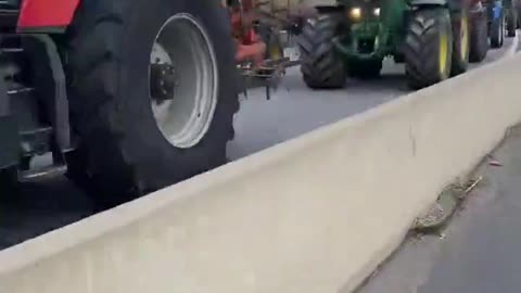 French farmers blocking the highway in France have formed a protest line