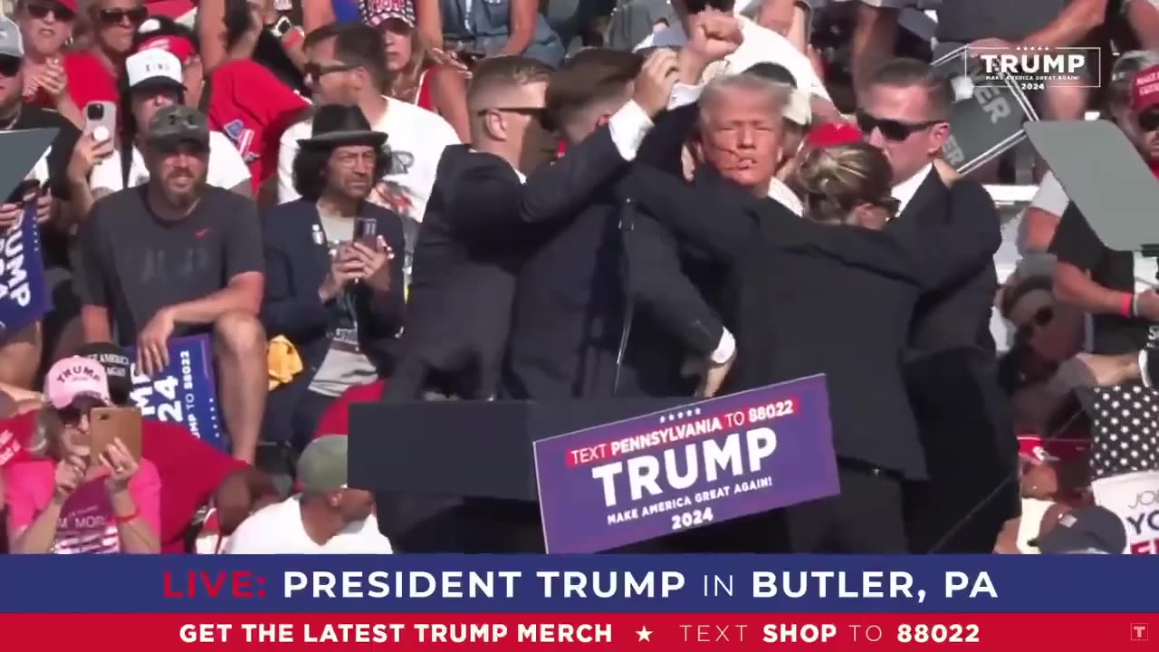 Trump pumps fist after assassination attempt 👊 before being rushed to hospital in ambulance 🚑