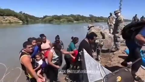 Border Patrol agents cut the wire for migrants to enter through the southern border