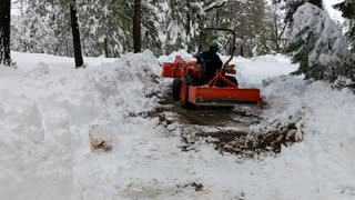 Removing snow from the driveway with our Kubota tractor part #2