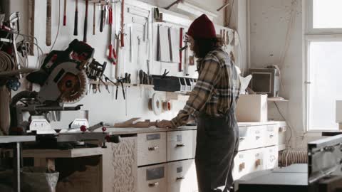 A Carpenter Writing in the Counter