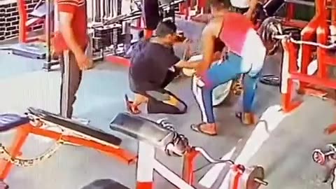 Boy fall from bench while doing exercise in a gym.