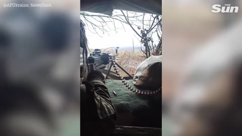 Ukrainian Machine Gunners shoot at Russian invaders from fortified position