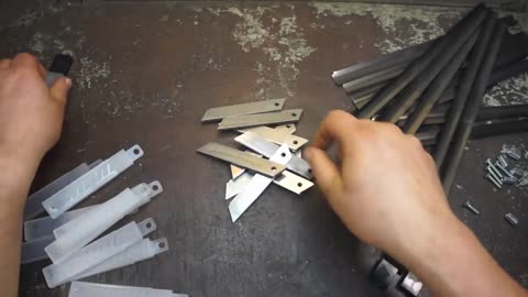 Damascus steel from two tape measures and 100 blades of stationery knives-3