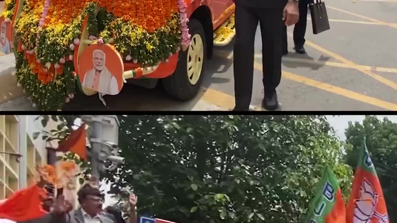 People shower flowers to welcome PM Modi