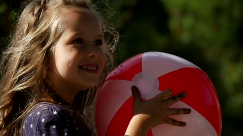 happy girl with an inflatable ball