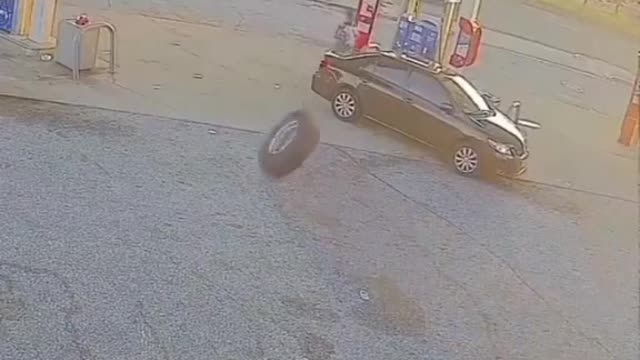 The car parked outside the gas station was met by unexpected trouble.