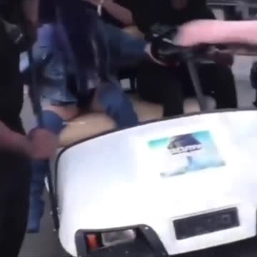 Lizzo almost flips over a golf cart with Cardi B in it