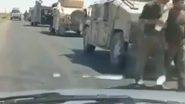 Afghanistan’s military convoy can be seen fleeing to Iran with their US equipment.